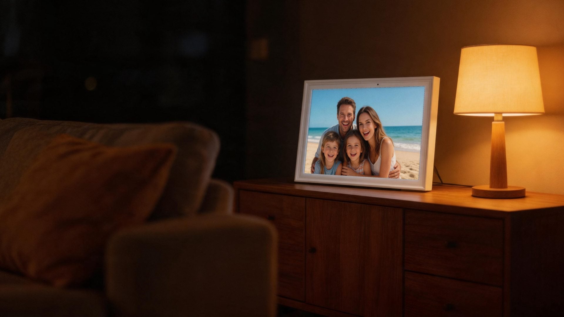 The calendar shows a family beach photo in a living room at night