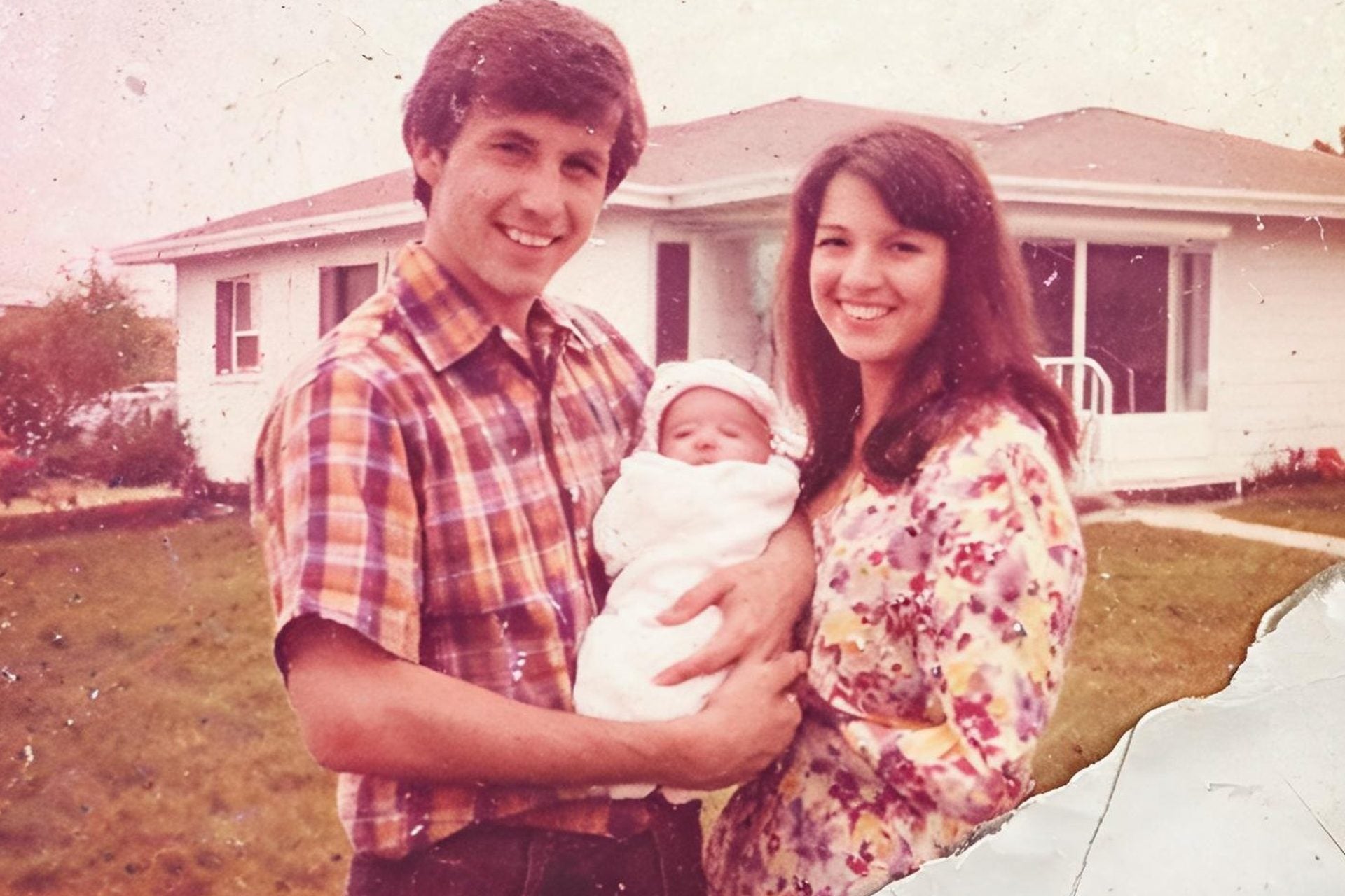 A faded, scratched 1970s family snapshot