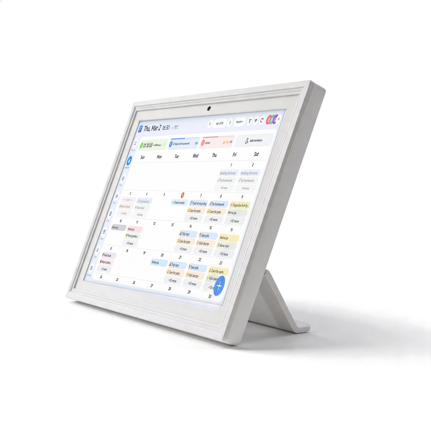 The white digital calendar on its desk stand, seen from the side
