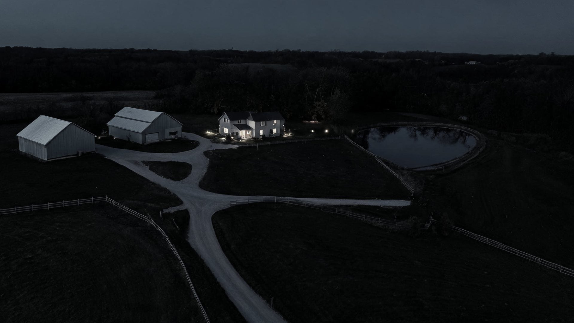 A farm at dusk seen from above, with its cameras marked as linked nodes