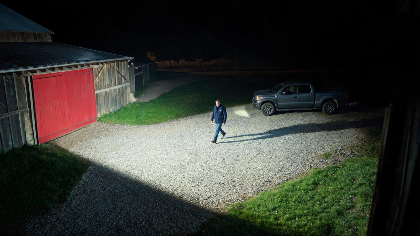 Color night footage of a farmyard